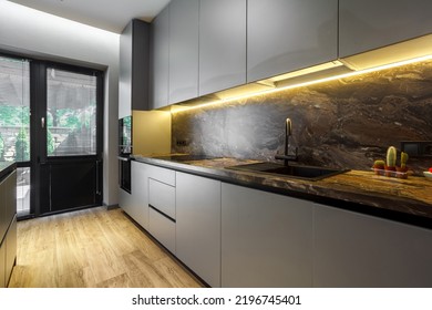 Modern Luxury Apartment With A Free Layout In A Loft Style In Gray And Dark Colors. Stylish Kitchen Area With An Island, Marble Countertop