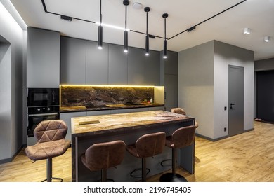 Modern Luxury Apartment With A Free Layout In A Loft Style In Gray And Dark Colors. Stylish Kitchen Area With An Island, Marble Countertop