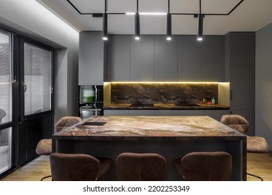 Modern Luxury Apartment With A Free Layout In A Loft Style In Gray And Dark Colors. Stylish Kitchen Area With An Island, Marble Countertop