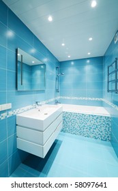 Modern luxury bathroom blue interior. No brandnames or copyright objects.