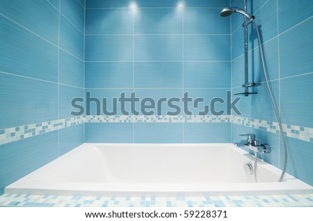 Modern luxury bathroom blue interior. No brandnames or copyright objects.