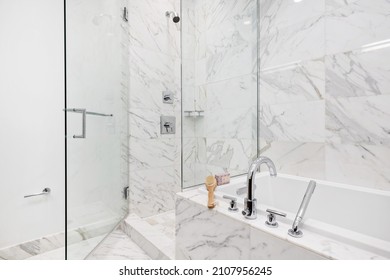 Modern Luxury Bathroom With White Marble Tile Shower Enclosure With Glass Door And Soaking Tub