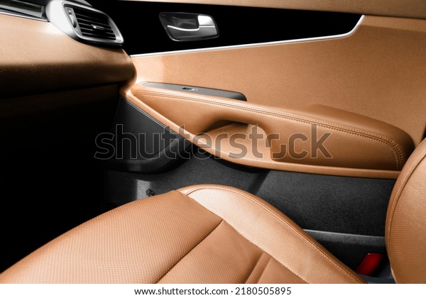 Modern luxury car\
brown leather interior. Part of brown perforated leather car seat\
details. Interior of prestige car. Comfortable perforated leather\
seats. Perforated\
leather.