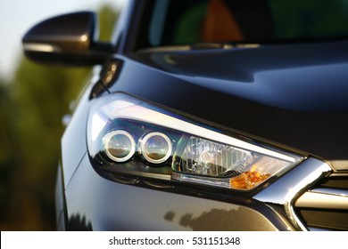 Modern and luxury car headlights. Exterior detail.