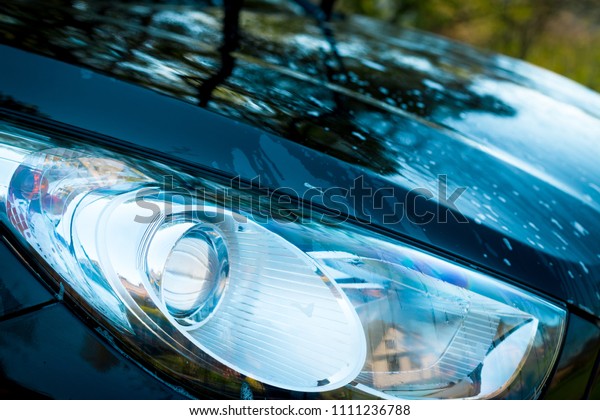 Modern and luxury car headlights. Exterior\
detail. Detail on one of the LED headlights modern car.Luxury Cars\
Headlight, exterior\
details.