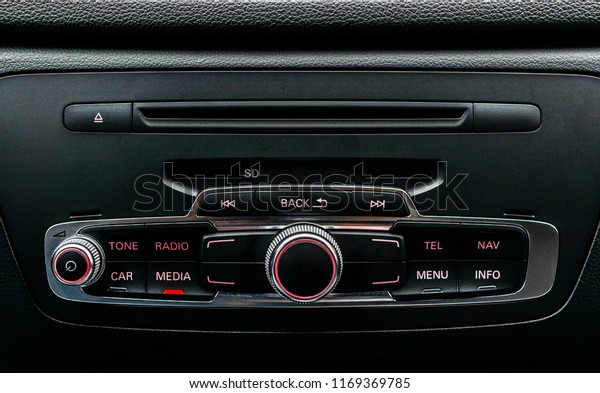 Modern Luxury car inside. Interior of prestige\
car. Black Leather. Car detailing. Dashboard. Media, climate and\
navigation control buttons. Sound system. Modern car interior\
details.