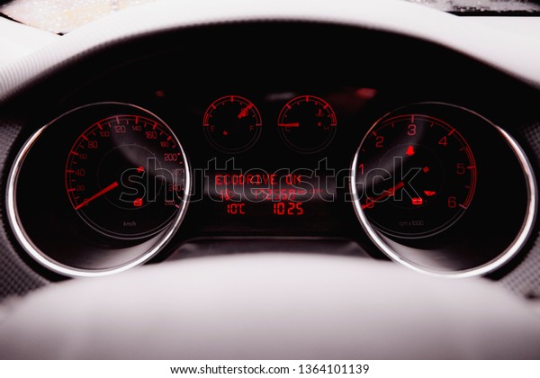 Modern\
Luxury car inside. Interior of prestige modern car. Black\
perforated leather cockpit. Steering wheel and dashboard. Automatic\
gear stick shift. Car interior. Car\
detailing