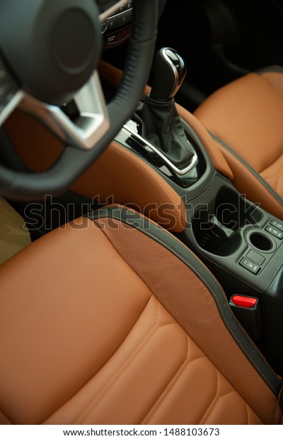 Modern Luxury car interior.\
Comfortable leather seats in cockpit. Modern car interior\
details