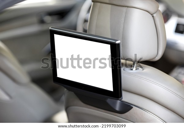 Modern luxury car interior with empty white\
touchscreen monitor with copy\
space.