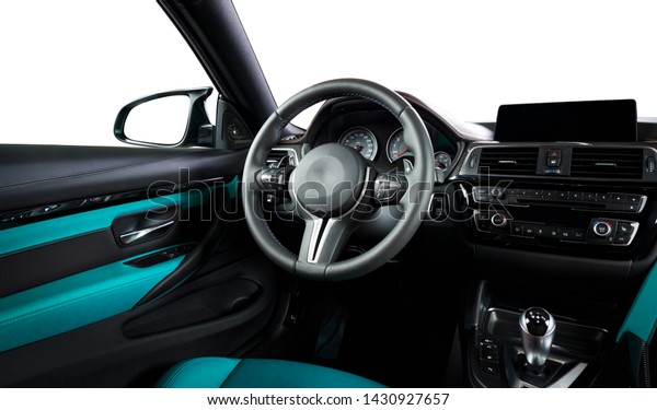 Modern luxury car\
Interior - steering wheel, shift lever and dashboard. Car interior\
luxury inside. Steering wheel, dashboard, speedometer, display.\
Cyan blue leather\
cockpit