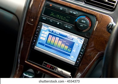 Modern Luxury Car Interior, Tv/dvd/audio System With Monitor And Climat Control View.