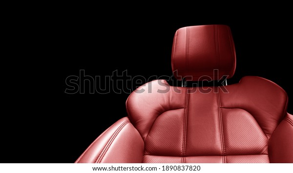 Modern luxury car red leather interior. Part of\
red perforated leather car seat details with white stitching.\
Interior of prestige car. Comfortable perforated leather seats.\
Perforated leather.