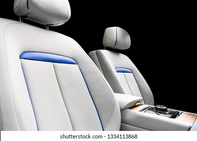 Modern Luxury Car White Leather Interior With Natural Wood Panel. Part Of Leather Seat Details With Stitching. Interior Of Prestige Modern Car. White Perforated Leather. Car Detailing. Car Inside