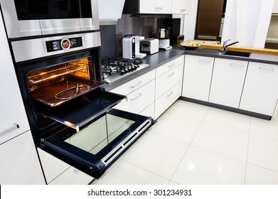 Modern Luxury Hi-tek Black And White Kitchen, Clean Interior Design, Focu At Oven With Open Door