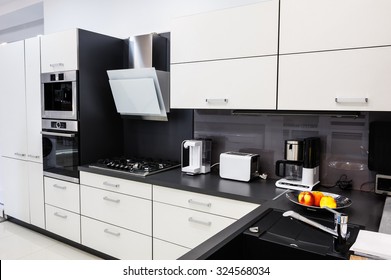Modern luxury hi-tek black and white kitchen interior, clean design - Shutterstock ID 324568034