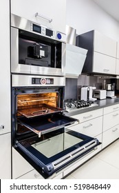 Modern Luxury Hi-tek Black And White Kitchen, Clean Interior Design, Focu At Oven With Door Open