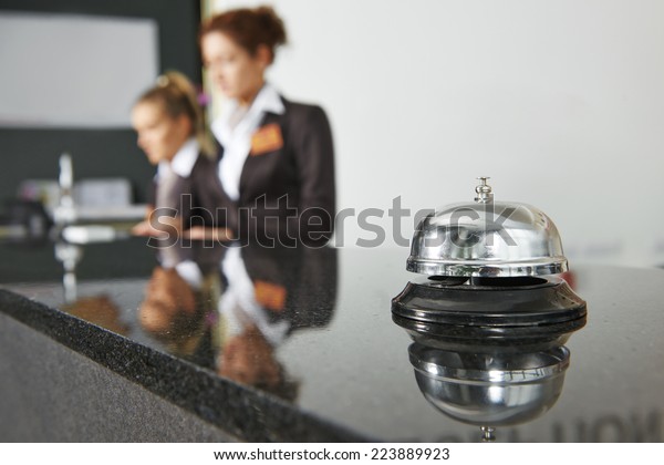 Modern\
luxury hotel reception counter desk with\
bell