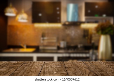 modern luxury kitchen black golden tone with wooden tabletop space for display or montage your products. 