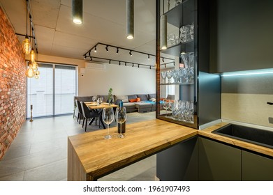 Modern Luxury Loft Studio Apartment Interior With Dining Table In Large Living Room