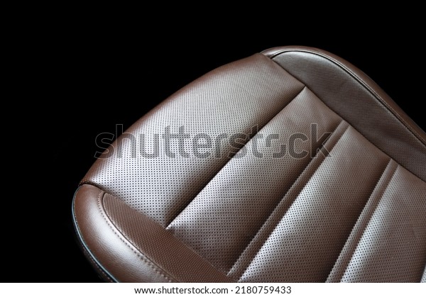Modern
luxury orange leather interior. Part of brown leather car seat
details with stitching. Interior of prestige car. Comfortable brown
perforated leather seats. Perforated
leather.