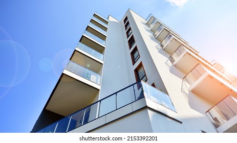 Modern luxury residential flat. Modern apartment building on a sunny day. Apartment building with a blue sky. Facade of a modern apartment building. - Shutterstock ID 2153392201