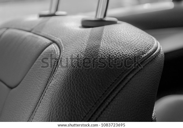 Modern Luxury sport car inside. Interior of
prestige car. Black Leather seats with stitching. Black perforated
leather. Modern car interior
details.