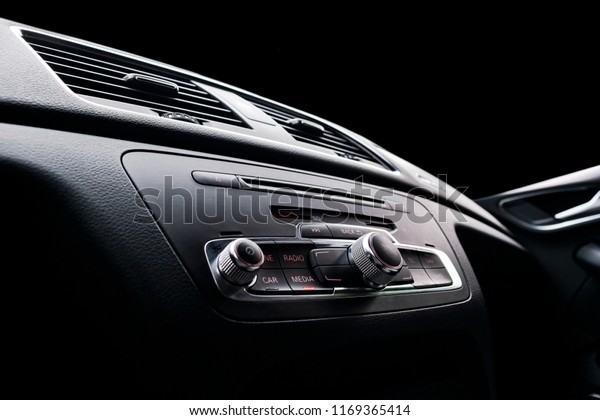 Modern\
Luxury sport car inside. Interior of prestige car. Black Leather.\
Car detailing. Dashboard. Media, climate and navigation control\
buttons. Sound system. Modern car interior\
details