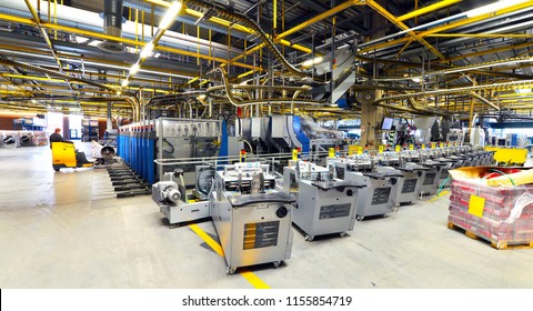modern machines for transportation in a large print shop for production of newspapers & magazines - Shutterstock ID 1155854719
