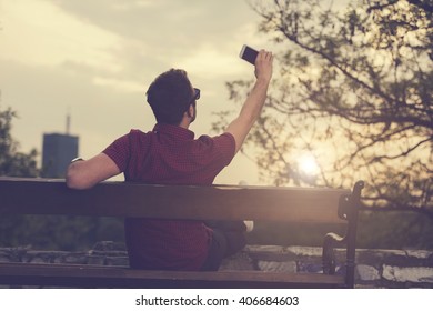 Modern man using a cellphone.