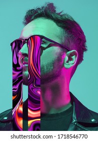 Modern man's portrait in sunglasses isolated studio background in neon light  Concept human emotions  facial expression  sales  ad  Stylish creative design  art vision  new look artwork 