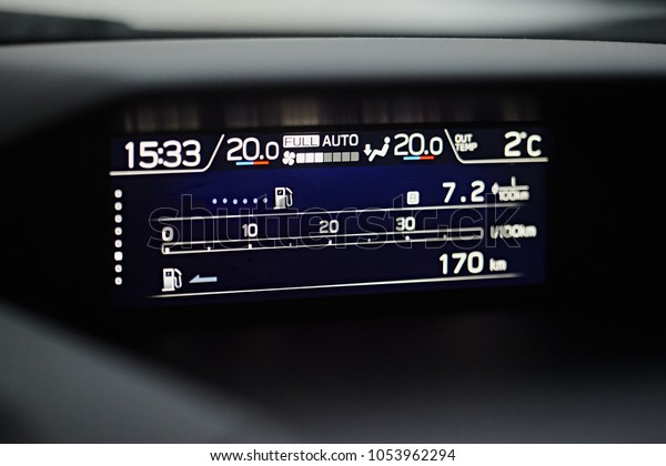 Modern media display in\
the interior of the car. The screen with multimedia shows fuel\
consumption
