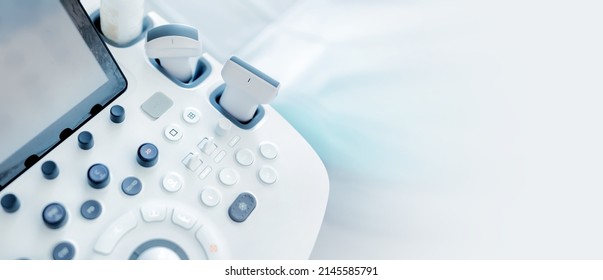 Modern medical equipment. An ultrasound machine and a couch. web banner - Shutterstock ID 2145585791