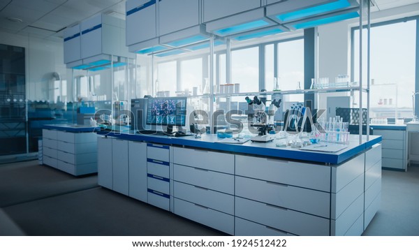 Modern\
Medical Research Laboratory with Computer, Microscope, Glassware\
with Biochemicals on the Desk. Scientific Lab Biotechnology\
Development Center Full of High-Tech\
Equipment.