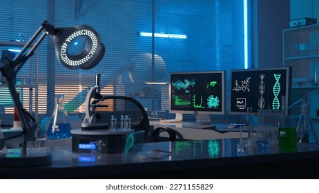 Modern medical research laboratory. Empty workplace of a scientist or researcher with computers, microscope, test tubes, flasks and magnifying lamp. Dark biochemical laboratory in the blue light.