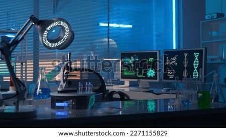 Modern medical research laboratory. Empty workplace of a scientist or researcher with computers, microscope, test tubes, flasks and magnifying lamp. Dark biochemical laboratory in the blue light. Zdjęcia stock © 