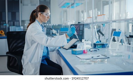 Modern Medical Research Laboratory: Female Scientist Working with Micro Pipette, Using Digital Tablet for Test Sample Analysis. Advanced Scientific Lab for Medicine, Biotechnology Development.
