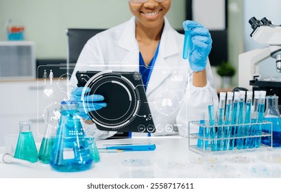 Modern medical research laboratory. female scientist working with micro pipettes analyzing biochemical samples, advanced science chemical laboratory for medicine.  - Powered by Shutterstock