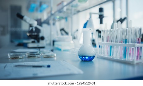 Modern Medical Research Laboratory with Glassware with Liquid Biochemicals on the Desk. Scientific Lab Biotechnology Drugs Development Center Full of High-Tech Equipment, Technology for Vaccine