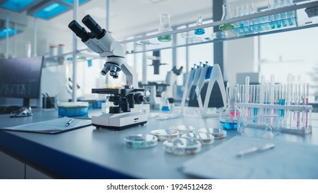 Modern Medical Research Laboratory with Microscope and Test Tubes with Biochemicals on the Desk. Scientific Lab Biotechnology Development Center of High-Tech Equipment, Technology. - Shutterstock ID 1924512428