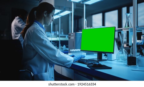 Modern Medical Research Laboratory: Portrait Of Female Scientist Working On Computer Showing Green Chroma Key Screen. Advanced Scientific Lab, Medicine Development Facility Biotechnology