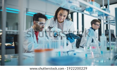 Similar – Image, Stock Photo Man scientist working at the laboratory. Selective focus.