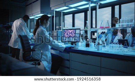 Modern Medical Research Laboratory: Portrait of Female Scientist Working on Computer, Analysing Biochemicals. Advanced Scientific Lab for Medicine, Biotechnology Development.