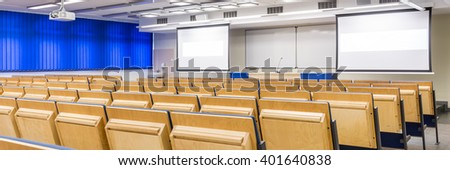 Modern medical university with spacious lecture hall with two screens