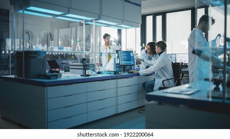 Modern Medicine Research Laboratory: Diverse Team Of Multi-Ethnic Young Scientists Analysing Test Samples. Advanced Lab With High-Tech Equipment, Microbiology Researchers Design, Develop Drugs