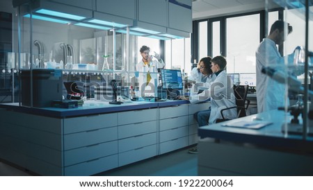 Modern Medicine Research Laboratory: Diverse Team of Multi-Ethnic Young Scientists Analysing Test Samples. Advanced Lab with High-Tech Equipment, Microbiology Researchers Design, Develop Drugs