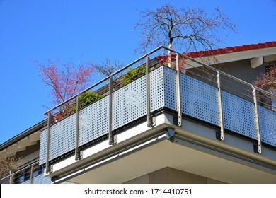 Modern Metal Balcony With High Grade Privacy Protection Screen And Metal Hand Rail At A Residential Building