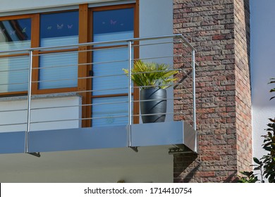 Modern Metal Balcony With High Grade Privacy Protection Screen And Metal Hand Rail At A Residential Building