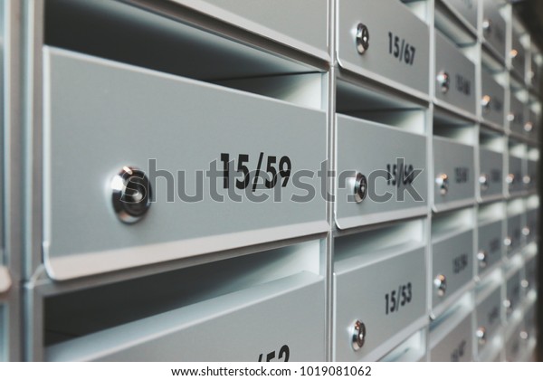 modern metallic\
mail box mail room in share common area space of condominium\
apartment flat unit mansion\
