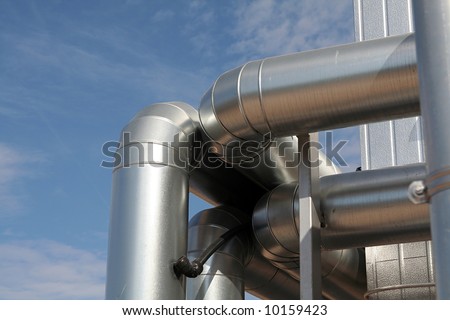 modern metallic ventilation ducts, blue sky background