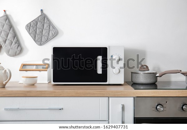 Modern microwave oven in\
kitchen